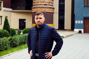 European caucasian white young male man with goatee beard looking at camera on St. Petersburg...