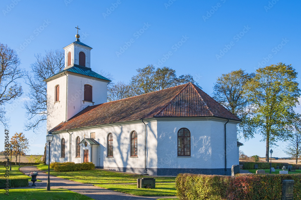 Poster Countryside church with a cemetery