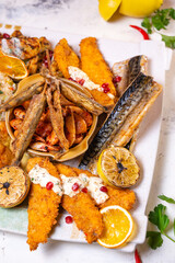 a set of different fish dishes on a white plate