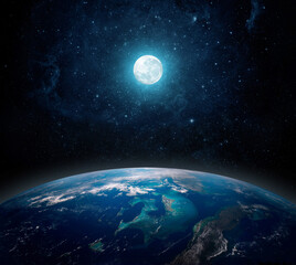 A full moon above the planet Earth. View from space to the starry sky full moon and the planet Earth. Elements of this image furnished by NASA.