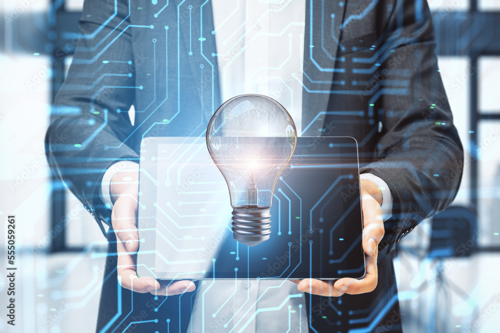 Poster Close up of male hands holding tablet with abstract circuit and lamp hologram on blurry background. Digital idea and data concept. Double exposure.