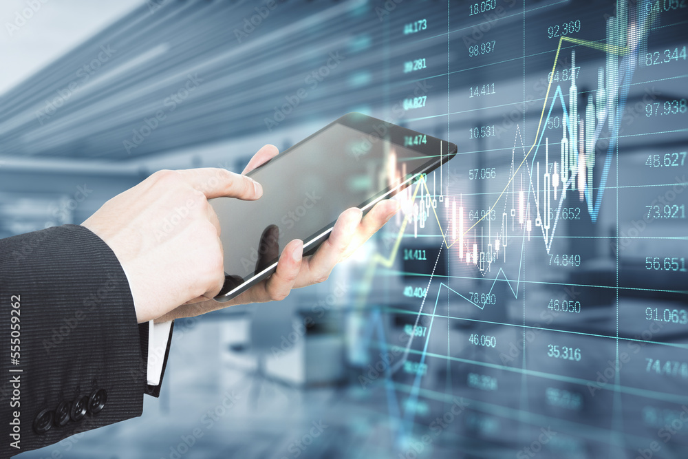 Aufkleber close up of businessman hand pointing at tablet with glowing forex index chart/graph on blurry offic