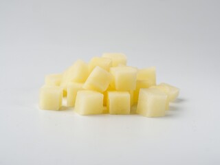 Heap of diced raw potatoes isolated on white