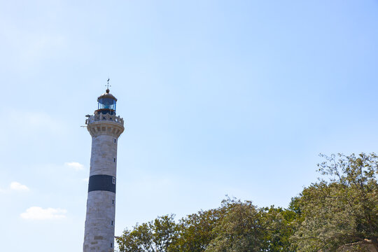 Historical lighthouse with daylight and trees. Ahirkapi lighthouse in Istanbul