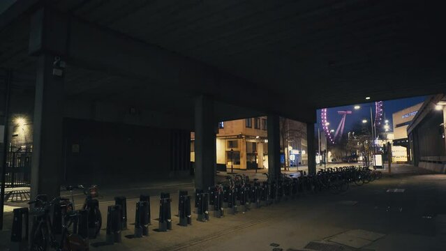 London road and street empty at night. Dark and mysterious city tunnel