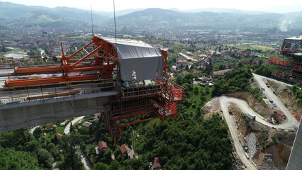 Aerial drone view on highway bridge road under construction. Construction of the viaduct on the...