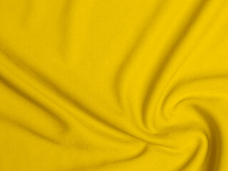 yellow velvet fabric texture used as background. Empty yellow  fabric background of soft and smooth textile material. There is space for text.