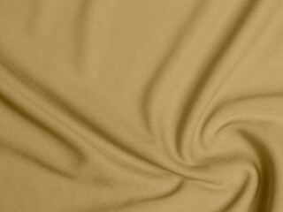 gold color velvet fabric texture used as background. blond color fabric background of soft and...