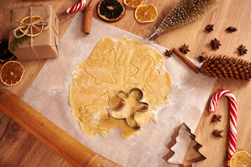 Christmas cookies. Making gingerbread cookies for Holidays. Gingerbread dough. Christmas Baking background. Form for cutting gingerbread. Merry Christmas and Happy Holidays.