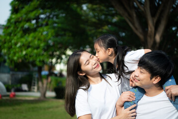 Obraz premium Vacation for a young family Spend this priceless time together playing on the village lawn.