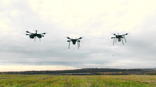 Drones in agriculture. Three drones that rise above the field and have different tasks.