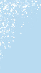 Snowfall overlay christmas background. Subtle flying snow flakes and stars on light blue winter backdrop. Festive snowfall overlay. Vertical vector illustration.