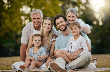 Family picnic, park portrait and smile with kids, parents or grandparents for bonding together,...
