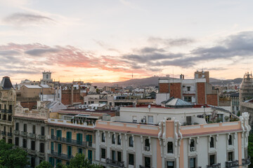Fototapeta na wymiar Shot of high spanish buildings in Barcelona with amazing sunset.