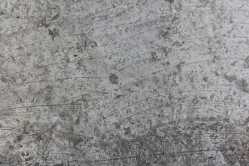 A concrete wall texture with cracks and scratches. Old cement wall, abstract background.