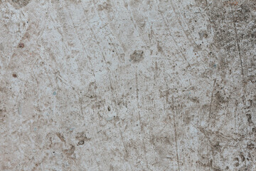 Abstract background, old cement wall close-up with detailed texture. Concrete wall with cracks and scratches.