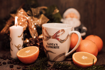 Christmas composition coffee beans, orange, wine, candle. New Year's table