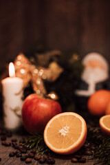 Obraz na płótnie Canvas Christmas composition coffee beans, orange, wine, candle. New Year's table