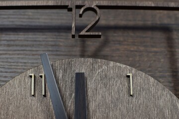 wooden clock on wooden background