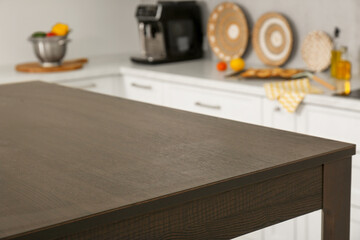 Stylish wooden table in kitchen. Interior design