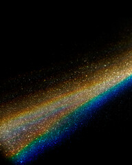 Rainbow sun flares on black background, colorful glare and shine, light rays on sparkling surface....