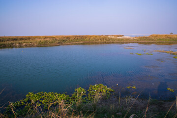Crystal clear blue water lake landscape view nearby Padma river in Bangladesh