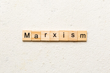 marxism word written on wood block. marxism text on table, concept