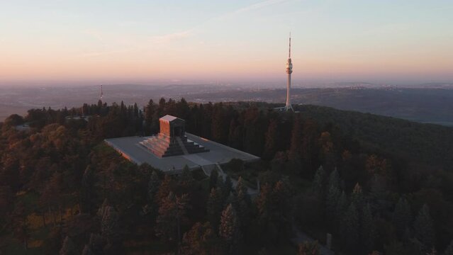 Aerial shot of mountain Avala, communication tower and a monument of unknown hero, symbols of Belgrade, Serbia.