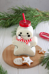 Milk and cookies for Santa. Milk is poured into a cute bottle in the shape of a gingerbread man. Christmas mood
