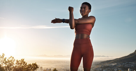 Fitness, black woman and stretching arm on mountains, blue sky or sunset for wellness, healthy...