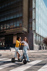 Curly Haired Girls Using Electric Scooter