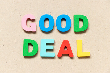 Color alphabet letter in word good deal on wood background