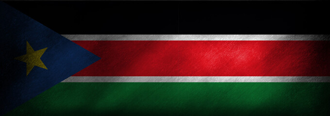 The flag of South Sudan on a retro background