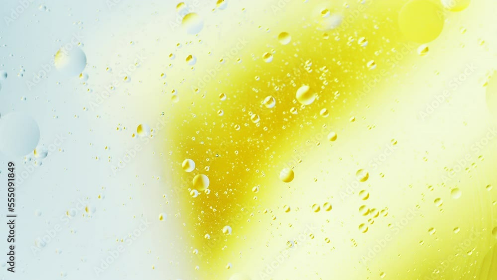 Aufkleber real close up oil bubbles in water rotation with color gradient abstract mixing background.