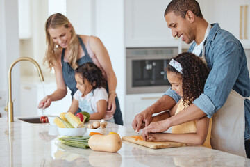 Family, mother and father with girls, vegetables or cooking together, interracial or bonding. Love,...