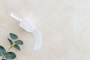 White washing powder with measuring cup. Laundry day concept