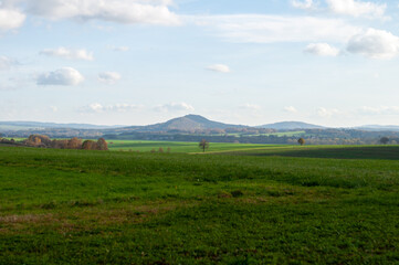 Fototapeta premium beautiful calm landscape. overlooking hills fields and forests under a cloudy sky