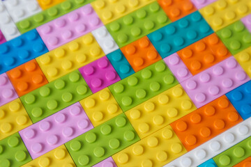 Multi-colored building blocks background top view copy space