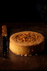 fresh biscuit for cake on table on dark background