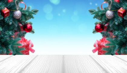 Beautiful foreground wooden floor and Christmas tree back. abstract bokeh background.