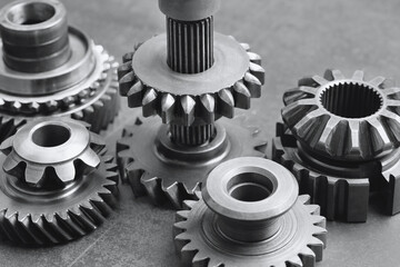 Different stainless steel gears on background, closeup