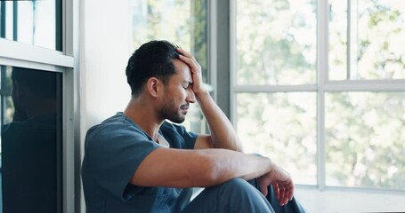 Nurse, stress or depression man on hospital floor in virus death, surgery fail or patient loss grief in Japanese clinic. Mental health, sad or anxiety for crying healthcare worker in medical burnout