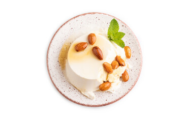 Ricotta cheese with honey and almonds isolated on white. top view, flat lay, close up.