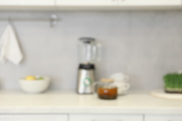 Naklejka na ściany i meble Blurred view of modern kitchen. Interior design