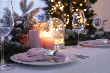 Obraz na płótnie Canvas Beautiful festive place setting with Christmas decor on table indoors