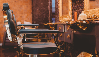 Fototapeta na wymiar Barbershop banner armchair, old vintage color. Modern hairdresser and hair salon, barber shop for men