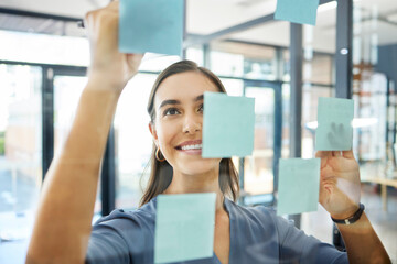 Agenda, writing or woman with sticky notes for goals, our vision or mission for a startup company in an office building. Smile, creative or happy employee planning ideas or a productivity schedule