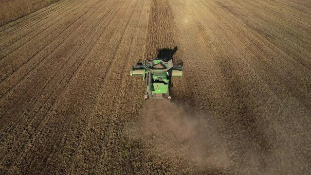 John Deere combine harvester on grain harvest. Wheat harwesting in field. Wheat planting. Wheat and corn markets in crisis world&rsquo;s breadbasket. Kazakhstan Alma-Ata, Aug 12, 2022.