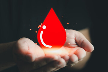 Red heart icon in man hands. Blood donation concept. World blood donor day