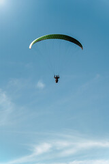 Amazing view of paragliding on the sky with epic sunlight
